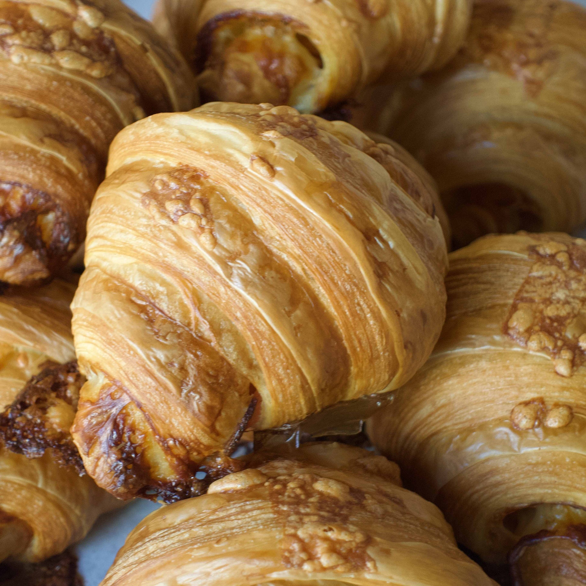 Ham & Cheese Croissant stacked on one another